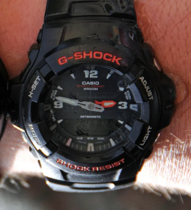 Close-up of a Casio G-Shock digital wristwatch being worn by a U.S. Marine diver while underwater.
